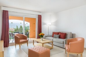Inviting living area with vibrant touches, ideal for unwinding or social gatherings.