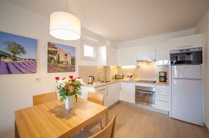 Sun-filled dining space with a welcoming vibe, perfect for shared meals.