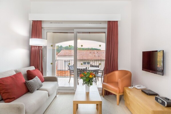 Comfortable living room with stylish seating and decorative touches.