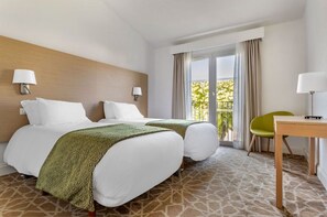 Restful sleeping space with plush bedding and natural light.