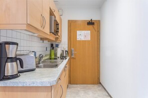  A compact yet fully functional kitchen space for culinary exploits.