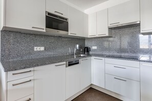  A modern, fully equipped kitchen for gourmet adventures.