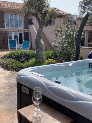 Spa in lower garden with solar shower,  views of villa, patio and terraces