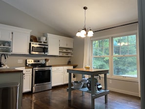 Large well stocked open kitchen with island