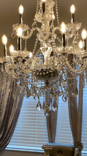 Beautiful Crystal Chandelier over  Fancy dinner table