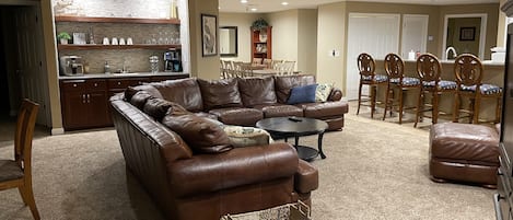 Leather sectional and chair with ottomon. Heavy weight comfortable bar stools.