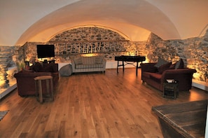 The beautiful vaulted lounge is the heart of the house and offers a convivial place to relax in the evenings