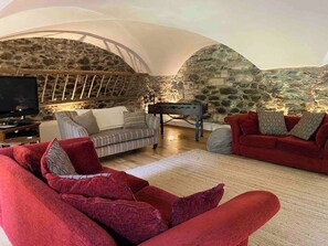 There are  three comfortable sofas, table football, a DVD player and games console ready to be enjoyed.