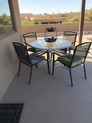 Comfortable eating area on the balcony with lovely views