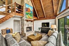 Warm wood ceilings and towering rock fireplace!