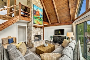 Warm wood ceilings and towering rock fireplace!