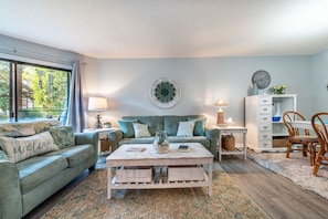 Homey living room with large TV, to watch UGA football.