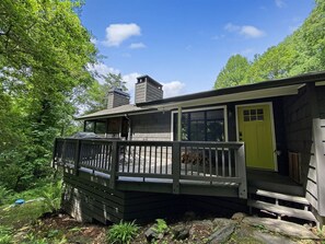 Front door, outdoor seating, and grill.