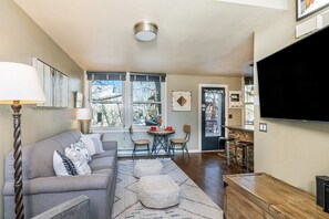 Spacious living and kitchen area that connects to beautiful riverfront deck.