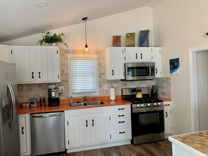 Stainless steel appliances and fully equipped kitchen