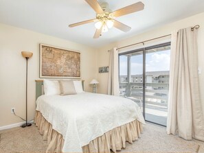 Master Bedroom with Queen Size Bed and Flat Screen TV, and access to Balcony