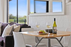 A pleasant space to enjoy meals together with a backdrop of the coastal landscape