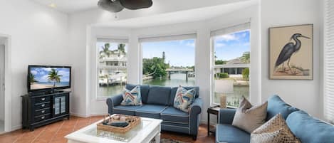 Relax and enjoy the sunshine and converging waterway views, whether inside or out!