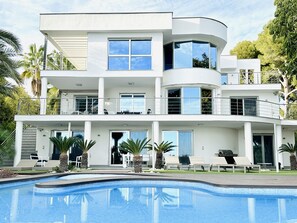 Façade of the 3-storey villa and its infinity pool