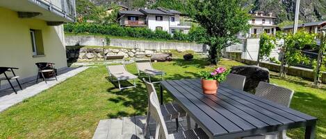 Plant, Table, Building, Mountain, Property, Furniture, Cloud, Flowerpot, Sky, Window