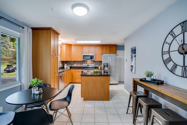 Main level fully stocked kitchen. Seats 7