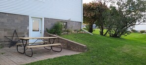 Backyard patio and picnic table. 