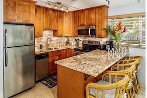 Kitchen. Cherry cabinets. Granite countertops and back splash 