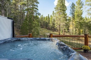 Hot Tub Serenity Under the Stars:
Unwind in the warm embrace of the hot tub on the back deck, perfect for stargazing and relaxing after a day of mountain adventures.