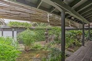 This enclosed koi pond will allow to really feel like you are in paradise
