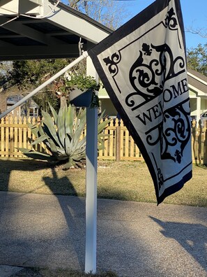 The Agave House featuring the Agave plant and welcome flag