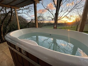 The Wood Fired Hot tub and an evening sunset!
