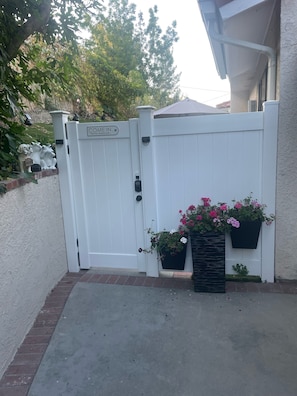Security gate to a private backyard 