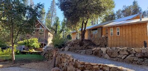 Path from home and hot tub to outdoor kitchen and river