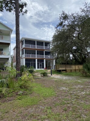 Back of the house. All porches and game room area are screened in.