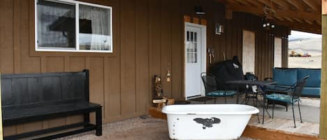 View of guest porch and entrance, pellet grill and utensils for our guests.