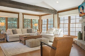 Living Room features a Plush Linen Sofa and Love Seat and Leather Rocking Chair.