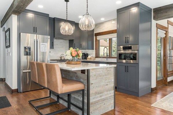 Beautifully Renovated Kitchen with Quartz Countertops and High End Stainless Steel Appliances
