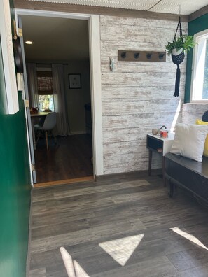 Sunroom off kitchen.
Sit, relax sip on coffee or tea.