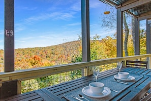 Dine or coffee al fresco protected from weather by upstair deck