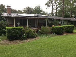 The partially covered patio is a great place to drink coffee or gather at night