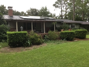 The partially covered patio is a great place to drink coffee or gather at night