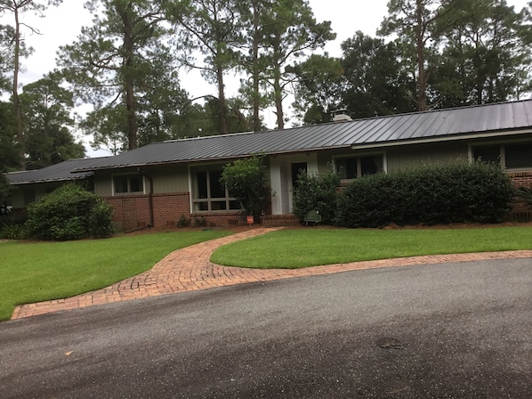 Front of house has a circular drive for easy parking