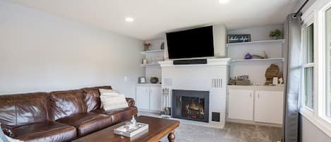 Living room with wood burning fireplace