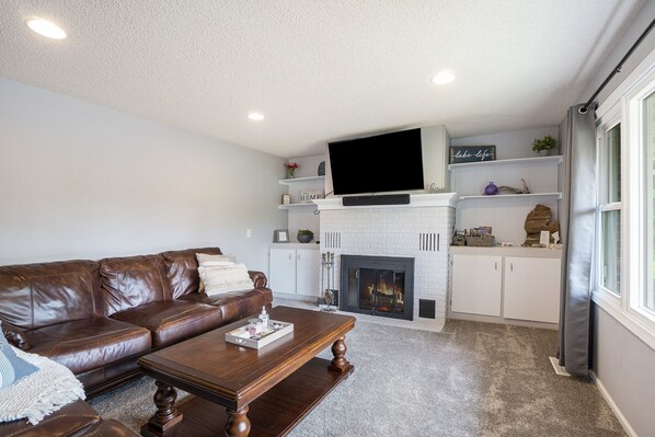 Living room with wood burning fireplace