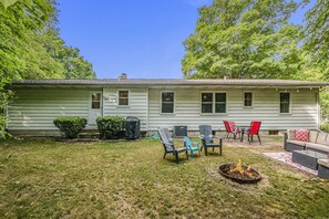 Backyard - firepit, gas grill, dining table and sectional seating with table