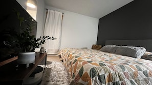 The second room: king bed (memory foam), smart tv (50”). Recently painted!