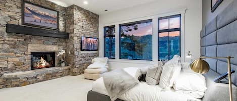 main master with view of Deer Valley Empire Pass with TV and easy gas fireplace.