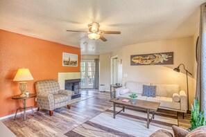 Spacious living room with couch and two reading areas