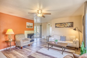 Spacious living room with couch and two reading areas