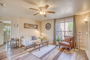 Spacious living room with couch and two reading areas